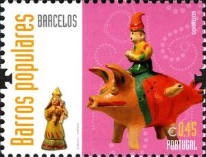 Colnect-2750-062-Barcelos--Man-riding-a-pig-----Our-Lady-with-the-baby-Jesus.jpg