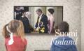 Colnect-4442-084-Children-watching-the-President-and-his-wife-on-tv.jpg