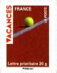 Colnect-1117-679-Holiday-Stamps--Tennis-ball-on-red-clay-court.jpg
