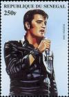 Colnect-2229-857-Elvis-in-Three-quarter-View--Singing-to-Handheld-Microphone.jpg