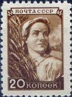 Colnect-460-824-Woman-the-collective-farmer-with-a-sheaf.jpg