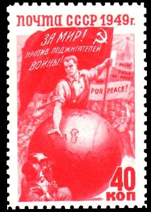 Colnect-1069-909-Worker-with-flag-behind-globe.jpg