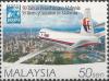 Colnect-4689-163-Boeing-747-400-over-Kuala-Lumpur.jpg
