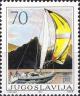 Colnect-3383-334-Yacht-by-coastline.jpg