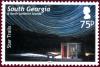 Colnect-1757-366-Star-trails-over-the-BAS-British-Antarctic-Survey-hut-at-M.jpg
