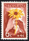 Colnect-2191-879-White-and-brown-hand-with-sunflower.jpg