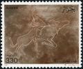Colnect-3120-081-Saharan-rock-art---buffalo-and-lion.jpg