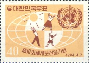 Colnect-2713-164-Children-globe-and-UN-emblem.jpg