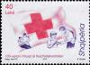 Colnect-3984-372-Red-cross-and-aid-workers-helping-injured-man-feeding-woman.jpg
