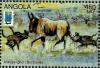Colnect-2220-176-Wildebeest-Connochetes-sp-and-African-Hunting-Dogs-Lycao.jpg