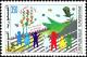 Colnect-6307-309-Bird-carrying-olive-branch-and-people-crossing-road.jpg
