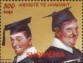 Colnect-609-969-Laurel-and-Hardy-wearing-mortarboards.jpg