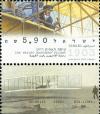 Colnect-2657-362-Orville-Wright-piloting-Wright-Flyer.jpg