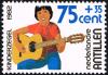 Colnect-2206-526-Child-playing-guitar.jpg