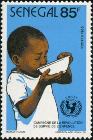 Colnect-2069-944-Boy-Drinking-from-Water-Bowl.jpg