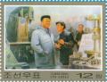Colnect-3199-593-Kim-Jong-Il-in-a-factory.jpg