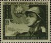 Colnect-4217-067-Romanian-soldier-in-front-of-flag-with-coat-of-arms.jpg