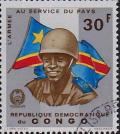Colnect-525-785-Soldier-in-front-of-national-flag.jpg