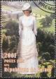 Colnect-4676-687-Diana-in-white-dress-and-small-hat-hands-behind.jpg