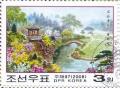 Colnect-3176-065-Pavilions-and-flowering-shrubs-on-Moran-Hill-Pyongyang.jpg