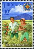 Colnect-2238-216-President-and-Mrs-Marcos-harvesting-miracle-rice.jpg
