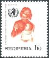 Colnect-2424-754-World-Health-Organization-Emblem-and-Mother-feeding-child.jpg