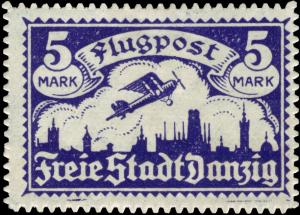 Colnect-4221-480-Monoplane-aircraft-over-the-silhouette-of-Gda%C5%84sk.jpg