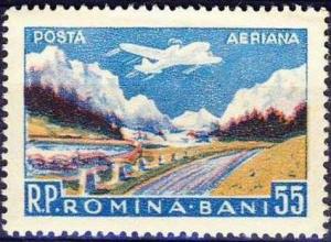 Colnect-781-349-Airplane-over-mountainous-landscape.jpg