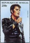 Colnect-2229-857-Elvis-in-Three-quarter-View--Singing-to-Handheld-Microphone.jpg