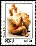 Colnect-1419-896-Mochican-Art---Figure-holding-severed-head.jpg